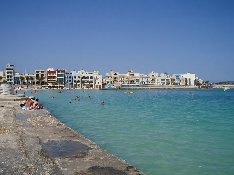 Families swimming in the calm shallow water at Pretty Bay